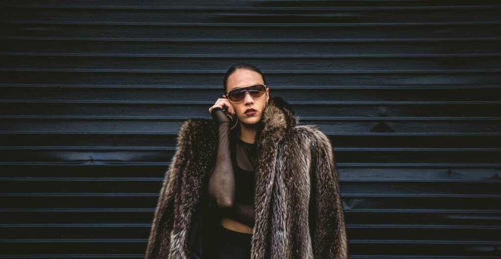 Woman in vintage mink coat at Fashion Week, symbolizing the story of protein and weight loss through presence and mindful eating